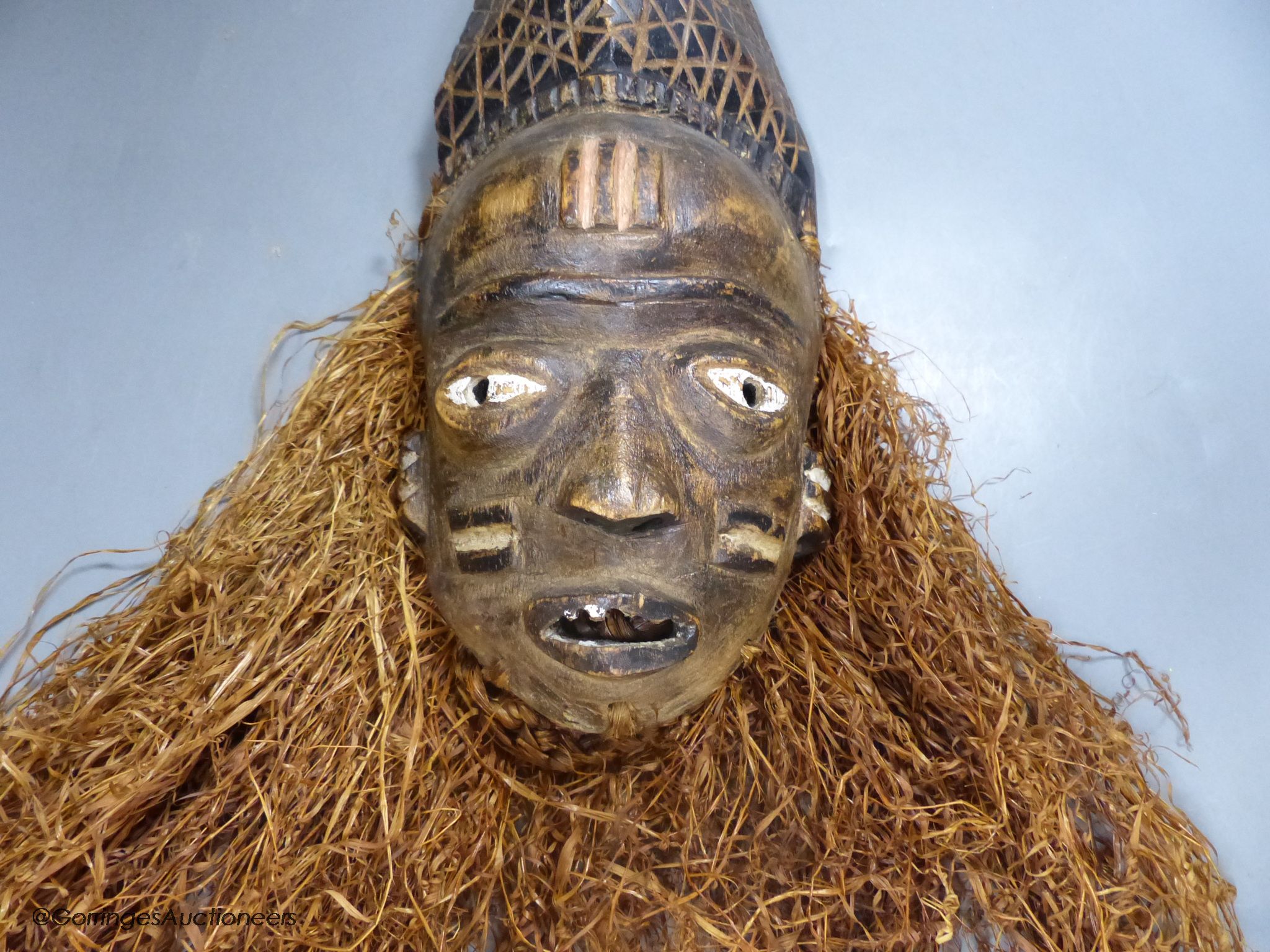 A Bapende tribal carved wood mask, 41cm high